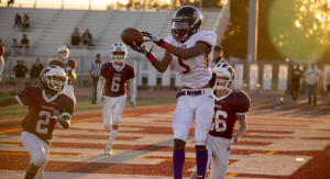 Image: A high school football player catches a touchdown