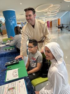 Image: Reed Horth and Kat Barrow-Horth pose for a photo at a recent event for children at Nicklaus Children's Hospital