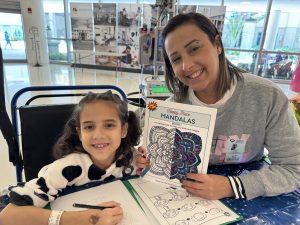 Image: A mother and daughter at the Star Wars-themed event at Nicklaus Children's Hospital
