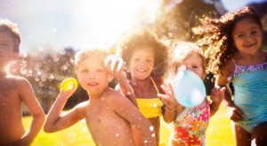 Image: Children holding water balloons
