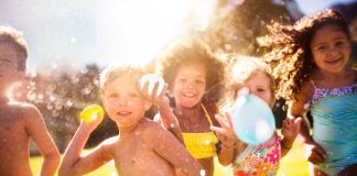 Image: Children holding water balloons