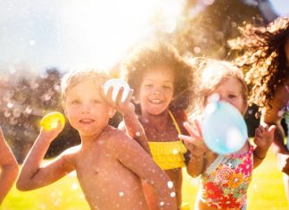 Image: Children holding water balloons