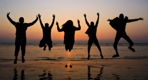 Image: A group of friends jumping in the air for a photo