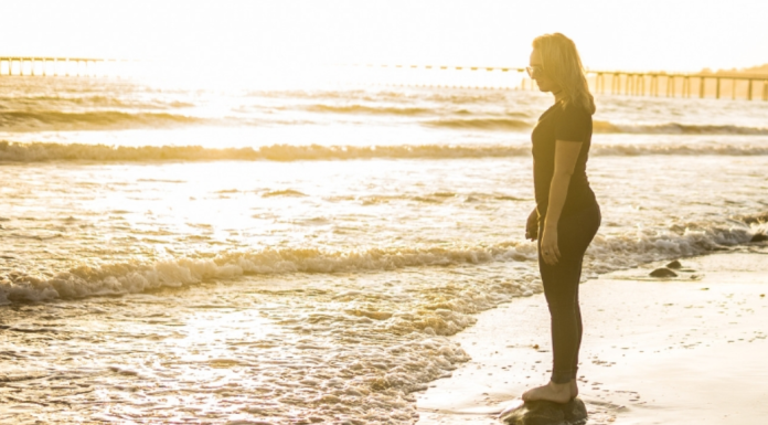 Infertility and Pregnancy Loss: The Personal Road to Recovery Image: A woman standing on the shoreline, watching the waves