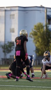 Image: A high school athlete prepares for a play