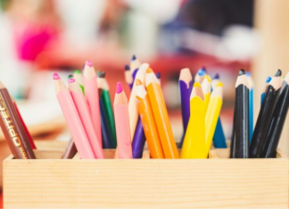Comic Kids: Join Us for a Morning of Art & Giving Back Image: A wooden box of art supplies on a table
