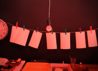 Image: Pictures being developed in a darkroom