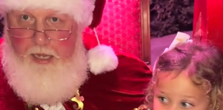 Image: Santa affirms a little girl with a message about consent after she says "No" to sitting on his lap in a TikTok video that went viral