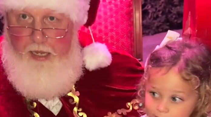 Image: Santa affirms a little girl with a message about consent after she says "No" to sitting on his lap in a TikTok video that went viral