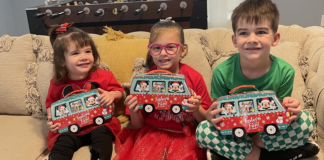 Image: Children holding holiday gifts