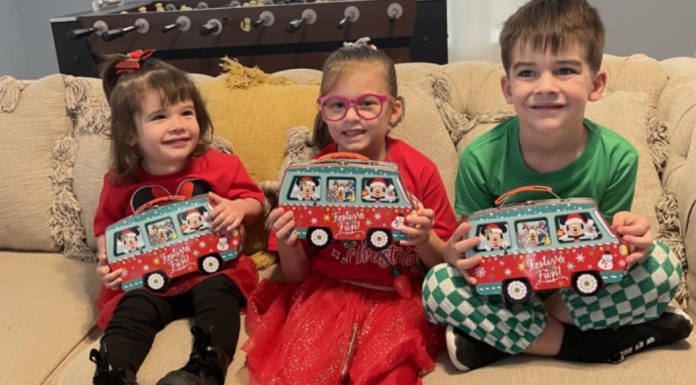 Image: Children holding holiday gifts