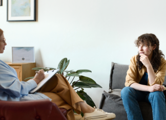 Finding the Right Therapist: How to Take the Guesswork Out of It Image: A therapist sitting with a client