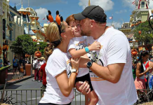Image: A family poses for a fall-themed photo on Main Street