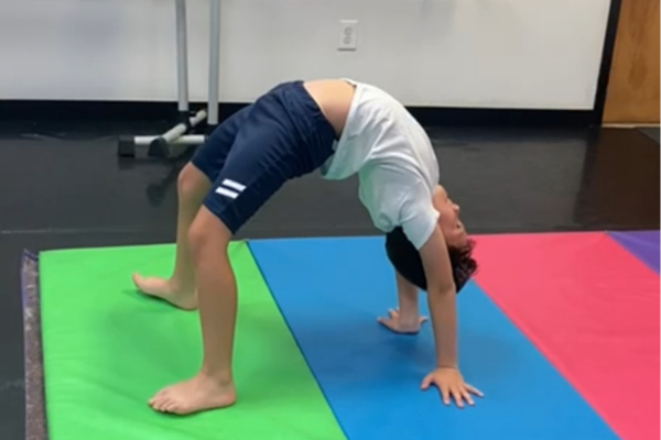 Image: A boy in a backbend