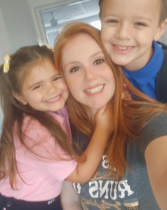 Image: Mom with two kids embracing a new chapter
