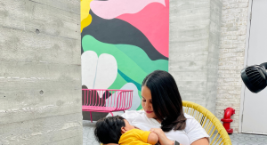 Image: A mother breastfeeds her toddler