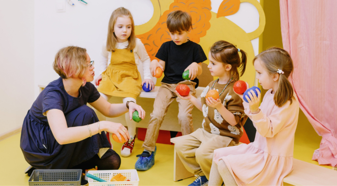 Image: A teacher works with a small group of students who may have IEPs
