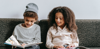 Image: Two children reading books together