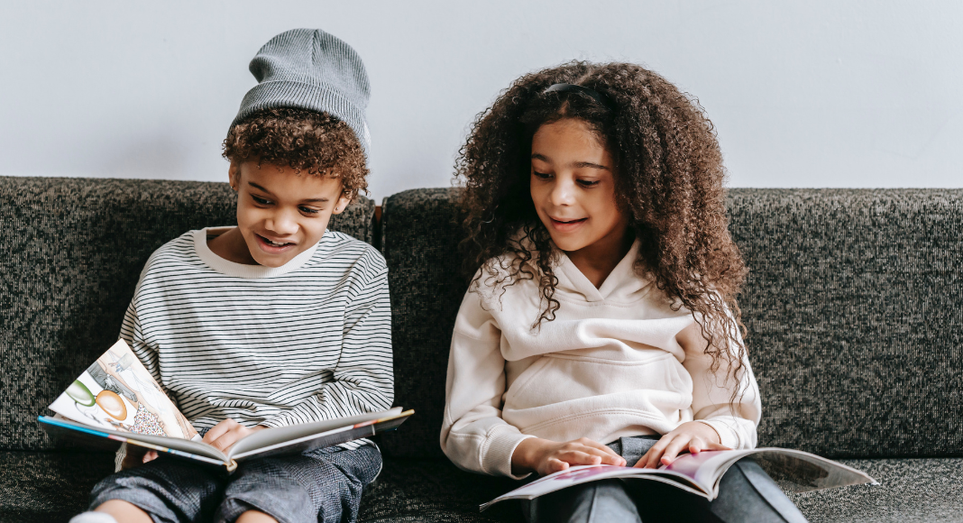 Image: Two children reading books together
