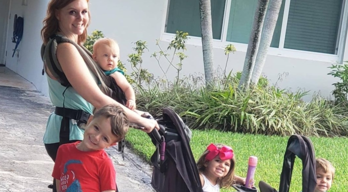 Surviving Summer: A Mother’s Guide Image: A mom out for a walk with 4 kids