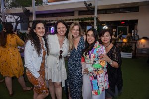 Image: A group of friends having fun at MMC's annual Bloom event