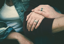Infertility, Miscarriage & Infant Loss: Encouragement on the Journey Image: A married couple sitting together, arm in arm