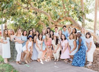 the Miami Mom Collective Team outside under a tree