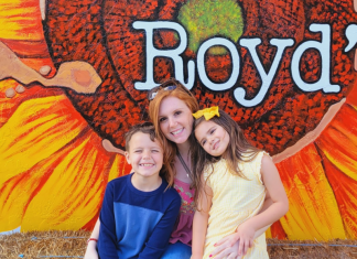 Local Hidden Gems: Royd’s and Baked and Churned Image: Two kids and a mom sitting on a haystack at Royd's