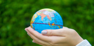 Earth Day: 7 Ways to Celebrate With the Kids Image: Hands holding a miniature globe
