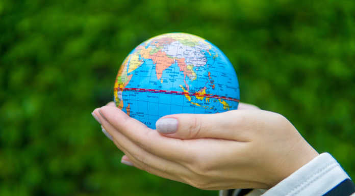 Earth Day: 7 Ways to Celebrate With the Kids Image: Hands holding a miniature globe
