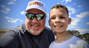 Image: My husband and son smiling for the camera