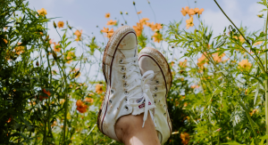 Image: Crossed ankles in a field of spring flowers