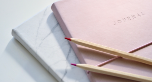 Image: A journal, notebook, and set of pencils