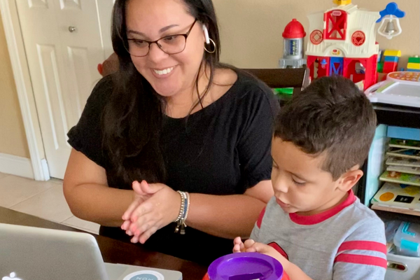 Image: Krystal working from home with her son by her side