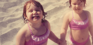 2 toddler girls happy on the beach