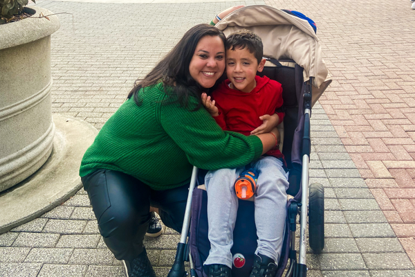 Image of a mother hugging her son on a trip