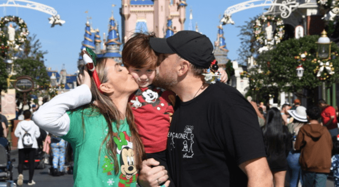 Sandra and her family pose for a photo at Magic Kingdom
