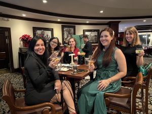 MMC team members raising their glasses to a great year