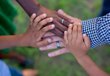 A family putting their hands together