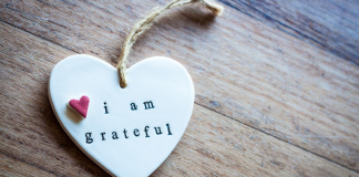 10 Ways to Cultivate Gratitude This Holiday Season A ceramic heart ornament that reads, "I am grateful"