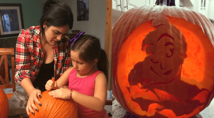 Diana helps her daughter carve a pumpkin for Halloween