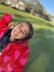 A little girl smiling and enjoying the outdoors. A learning disability isn't something to fear.