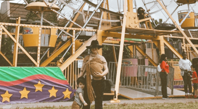 Jacqueline at a carnival with her children