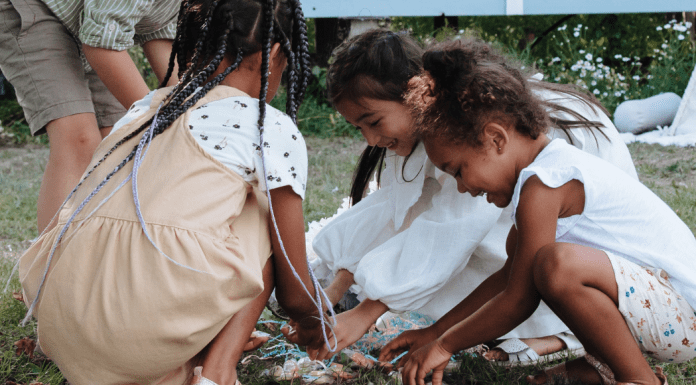 Candy Overload: 3 Tips for Managing Sugary Treats | Dr. Bob A group of children gather pieces of candy from a broken pinata