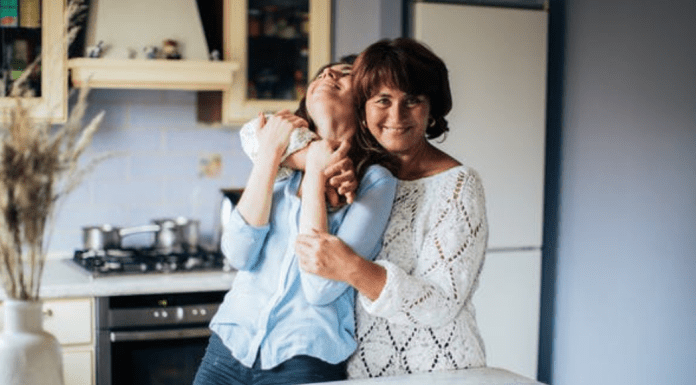 Mom giving hugs goodbye to her new college student