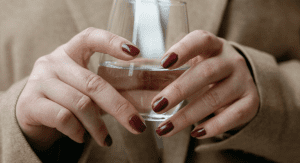 A corporate woman holding a glass of water
