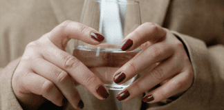 Pumping at the Office: 5 Helpful Tips A corporate woman holding a glass of water