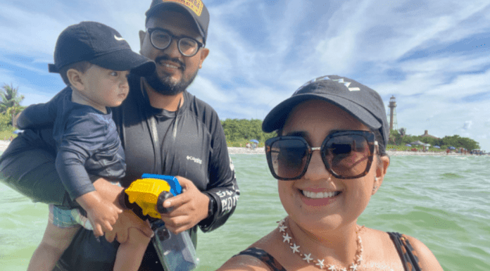 A family enjoys the beach on Sanibel Island, FL