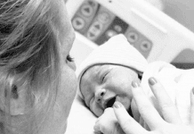 Mom getting ready to breastfeed for the first time in the hospital