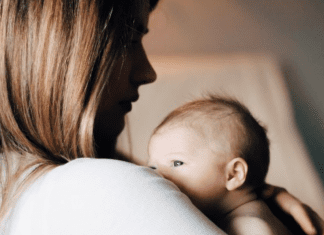 A mother holding her newborn baby